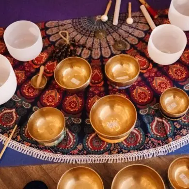 Singing bowls and chimes laid out for a sound session